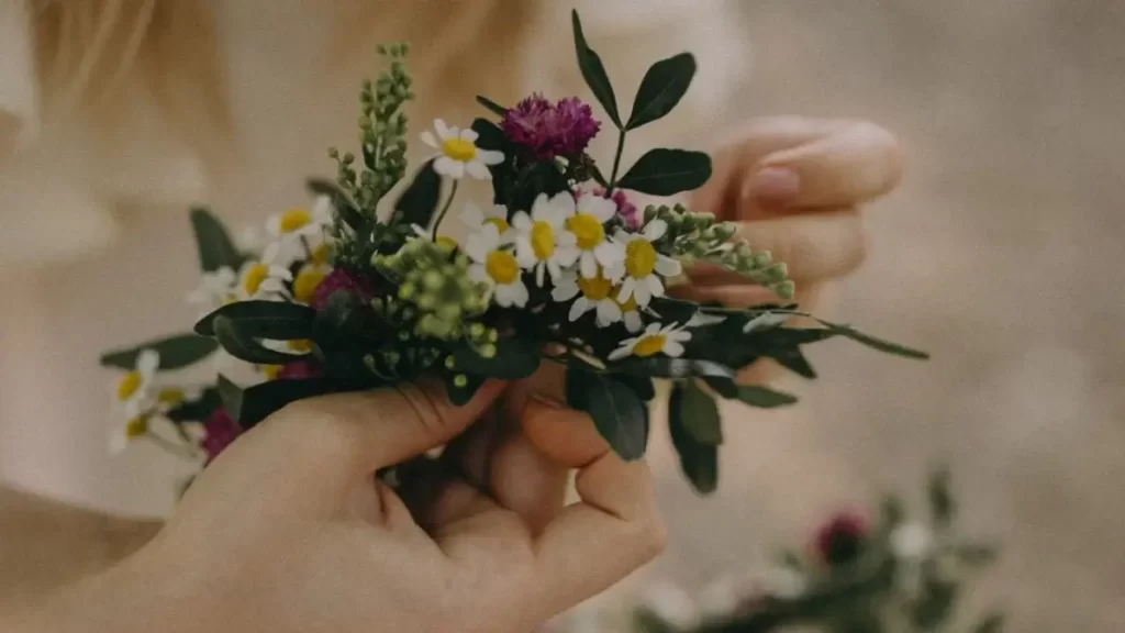 Image showing crop woman with wreath of blooming flowers - Photo by Anna Alexes from Pexels: https://www.pexels.com/photo/crop-woman-with-wreath-of-blooming-flowers-8820041/